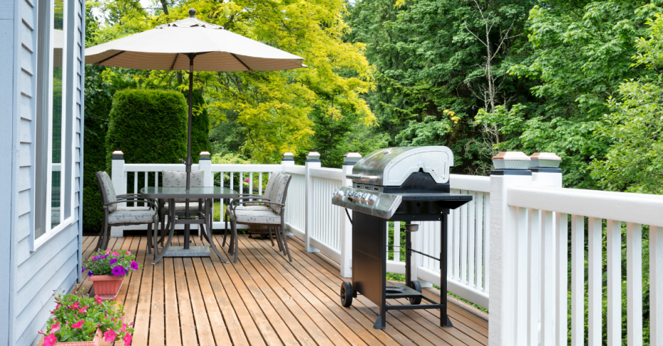 Backyard deck with table and umbrella